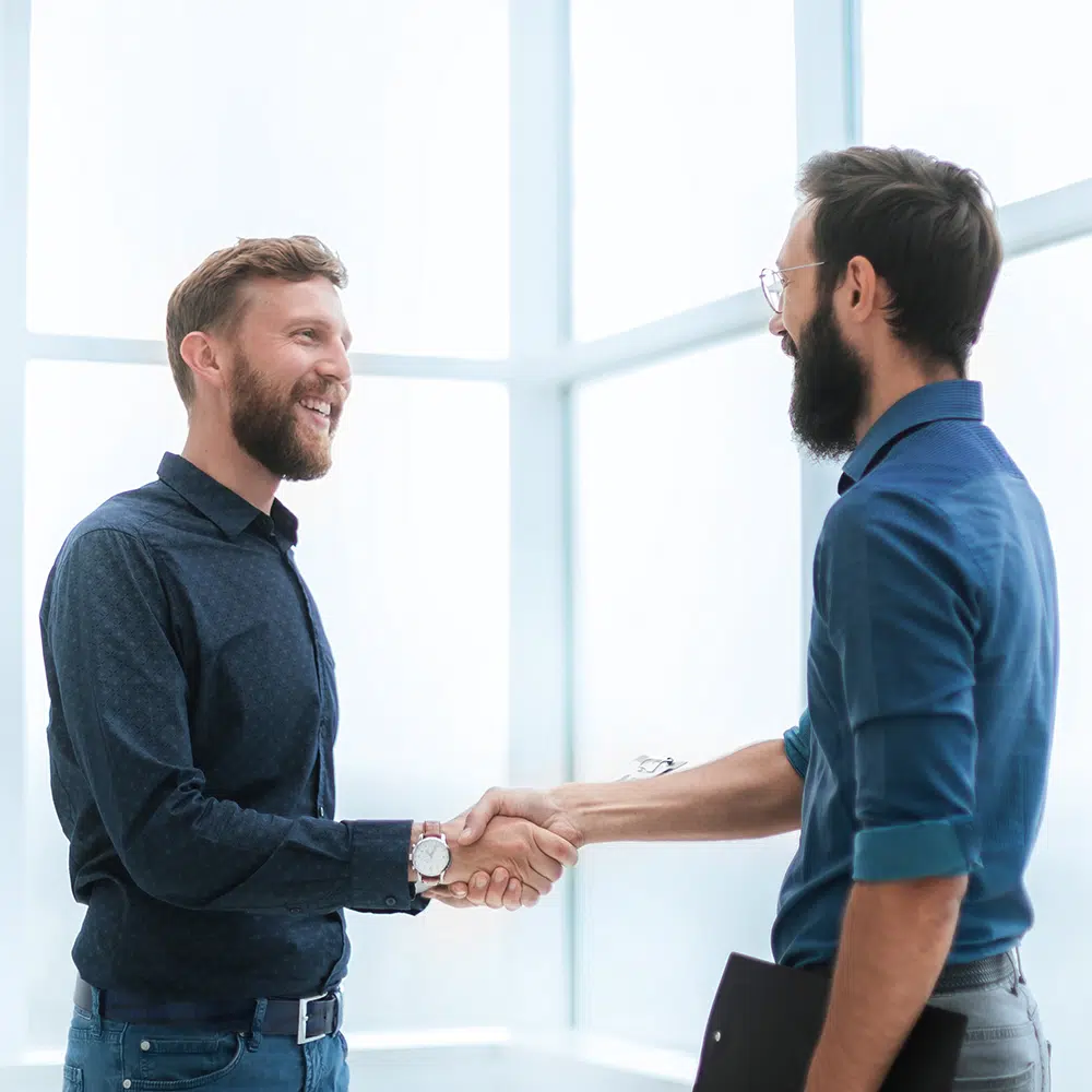 Men shaking hands and making a deal